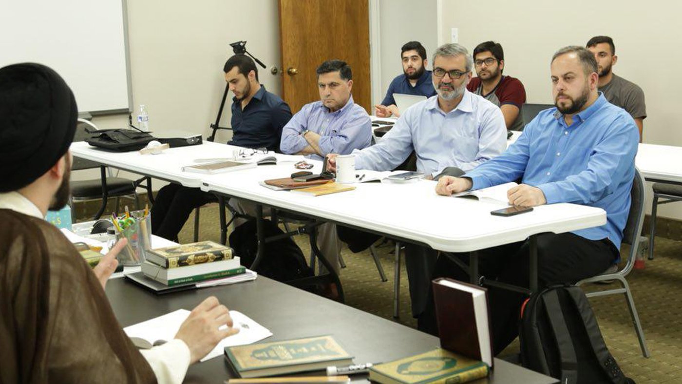 A seminar in session with the teaching scholar